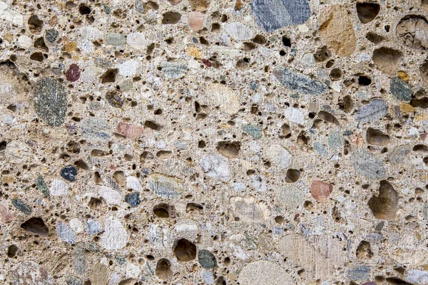 Surface of an old stone porous wall