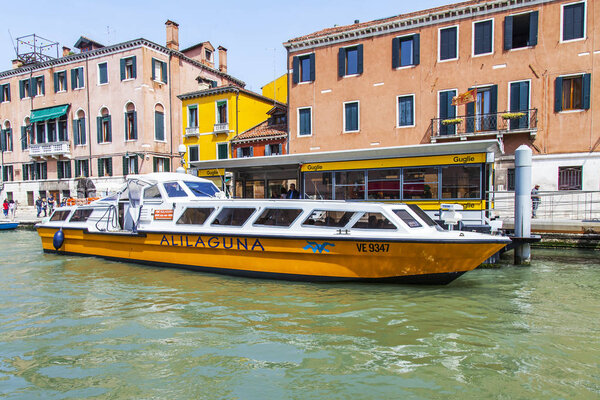Venice, Italy, on April 25, 2019. The canal embankment in one of historic districts of Venice - Cannaregio. The water Alilaguna shuttle follows from the airport