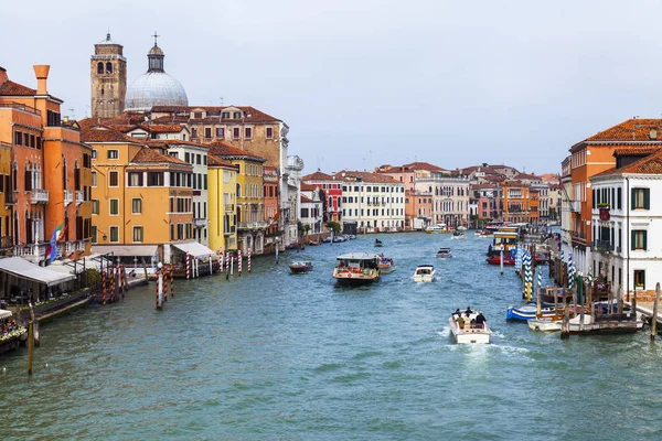 stock image Venice, Italy, on April 25, 2019. View of Canal Grande. Various boats float by a fine architectural complex of embankments