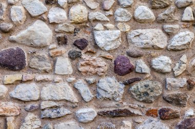 Eski bir taş gözenekli duvarın yüzeyi