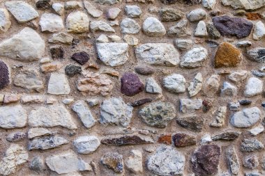 Eski bir taş gözenekli duvarın yüzeyi