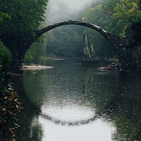 Autumn landscape of Rakotz Bridge (Rakotzbrucke, Devil's Bridge) in Kromlau, Saxony, Germany