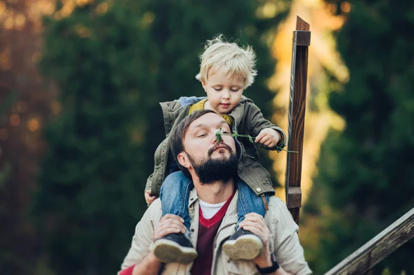 Young family with little son spending time together outside. — Stock Photo, Image