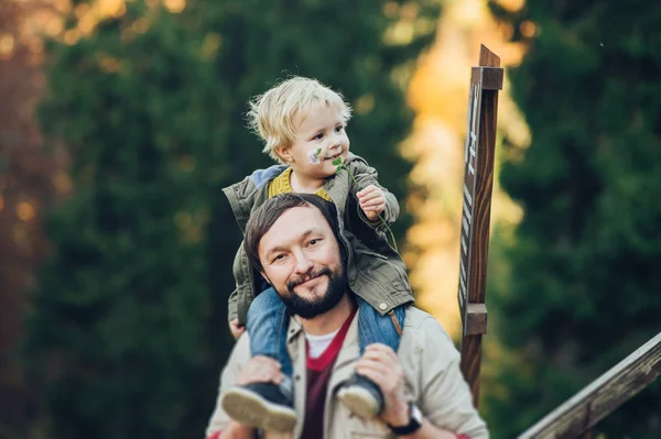 Young family with little son spending time together outside. — Stock Photo, Image