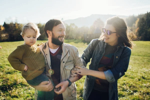 Happy family: mother father and child in mountains. — Stock Photo, Image