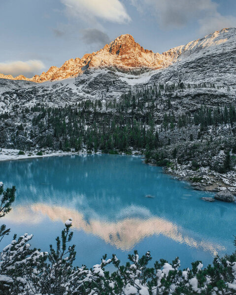 Mountain lake with blue water. Sunrise in the mountains. Lake Sorapis in the Dolomites. Lago di Sorapis. Royalty Free Stock Photos