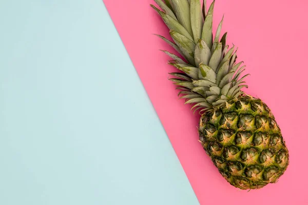 Pineapple fruit on bright pink background minimal summer food concept