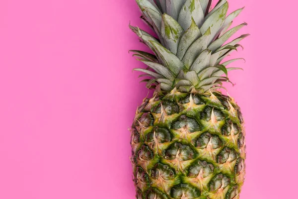 Pineapple fruit on bright pink background minimal summer food concept