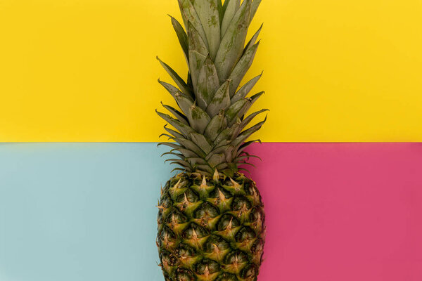 Pineapple fruit on bright yellow background minimal summer food concept