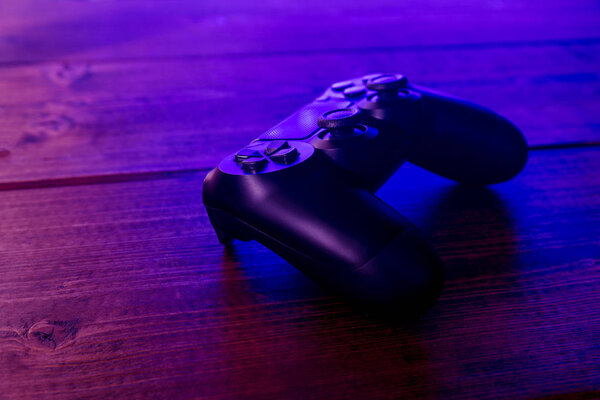Video game controller at night with lights