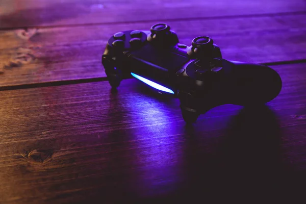 Video game controller at night with lights