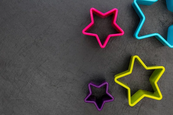 Cookie Cutter Star Shapes Dark Background — Stock Photo, Image