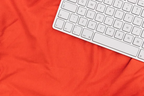 Computer keyboard top view on bright orange color background — Stock Photo, Image