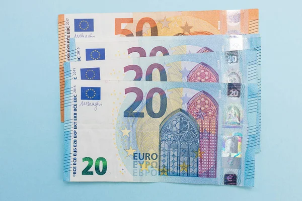 Euro currency cash bank notes money blue background — Stock Photo, Image