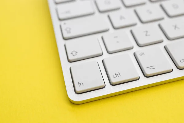 Computer keyboard minimal home office bright yellow color backgr — Stock Photo, Image