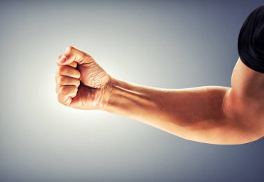 a strong man's hand bent into a fist. Boxing, kick clipart