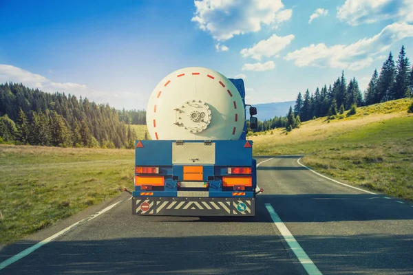 White Tanker Trucks Driving Picturesque Mountain Highway Blue Sky White — Stock Photo, Image