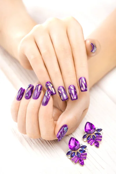 Beautiful Purple Manicure Earrings White Wooden Table — Stock Photo, Image