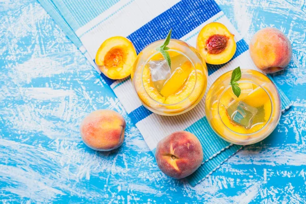 Ripe Peaches Cocktail Ice Fresh Mint Blue Table Refreshing Summer — Stock Photo, Image