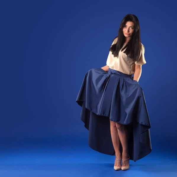 Beautiful Brunette Woman Lush Long Skirt Posing Blue Studio Background — Stock Photo, Image