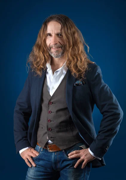 Long Haired Stylish Man Jeans Jacket Blue Background Studio Photography — Stock Photo, Image