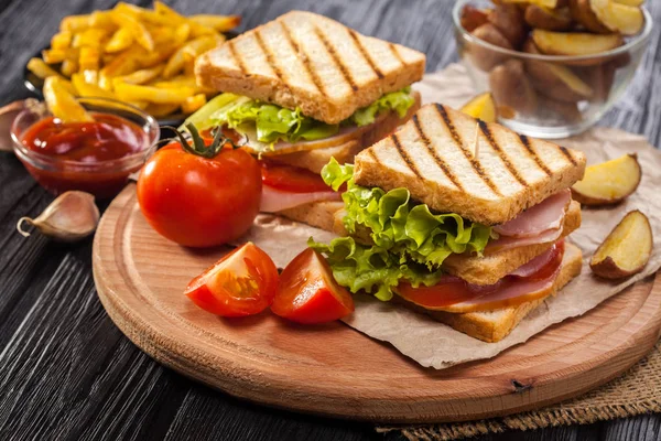 Club Sandwich Tomato Lettuce Bacon Ham French Fries Black Wooden — Stock Photo, Image