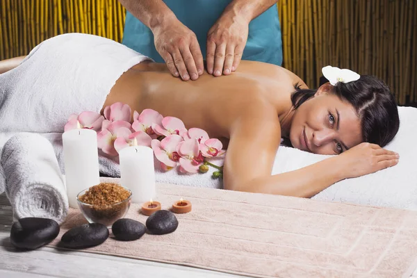 Beautiful brunette woman in a massage salon — Stock Photo, Image