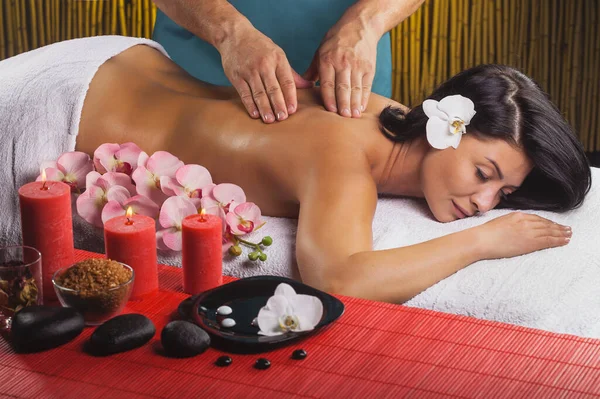 Beautiful brunette woman in a massage salon — Stock Photo, Image