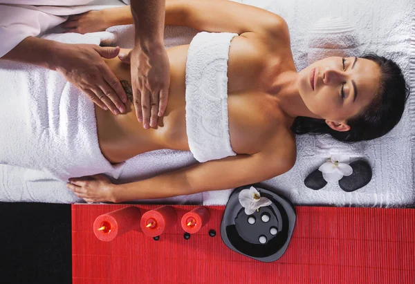 Beautiful brunette woman in a massage salon — Stock Photo, Image