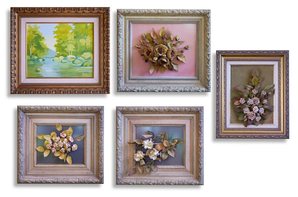 Collection of decorative paintings and porcelain flowers on a fr