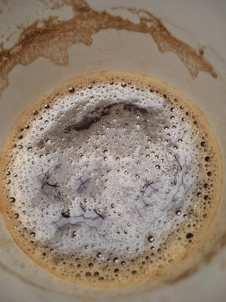 Is it safe to dispose of coffee grounds down the sink?