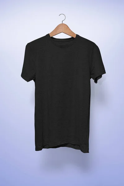 Black T-Shirt on a hanger against a light blue background