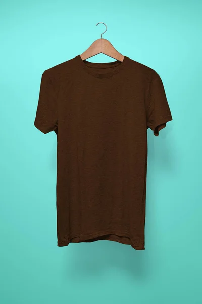 Brown T-Shirt on a hanger against a turquoise background