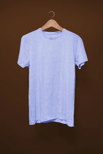 Light Blue Shirt Hanger Brown Background — Stock Photo, Image