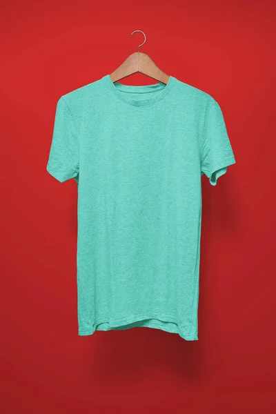 Turquoise Shirt Hanger Red Background — Stock Photo, Image