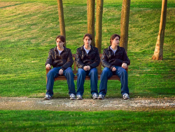 Three Clones Same Man Sitting Bench — Stock Photo, Image