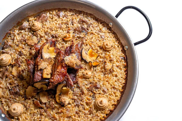 Stock image Rice with meat and mushrooms on a frying pan