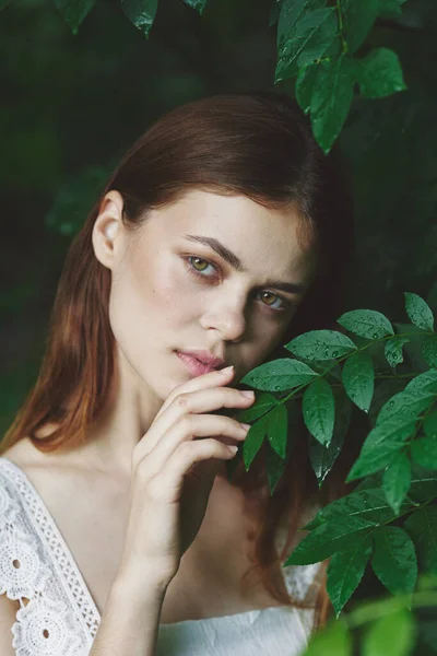 stock image portrait of young beautiful woman posing in park.