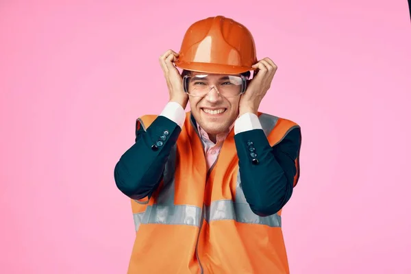 young male worker  with protective glasses   in studio