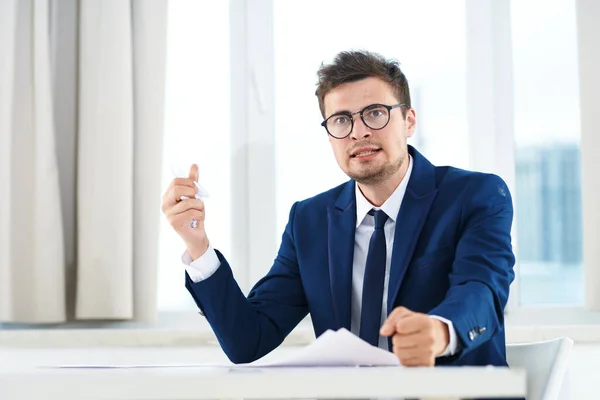 Young  very angry  businessman working  in the office