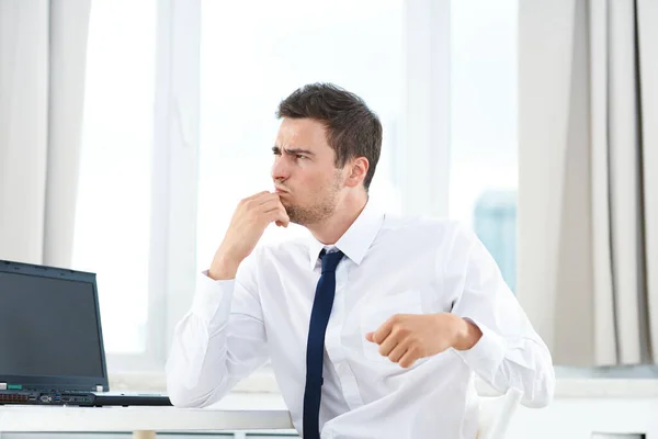 Young  businessman thinking   in the office