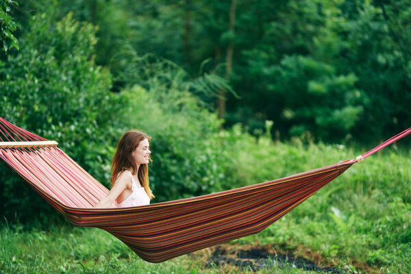 Young beautiful woman relaxing in hammock 