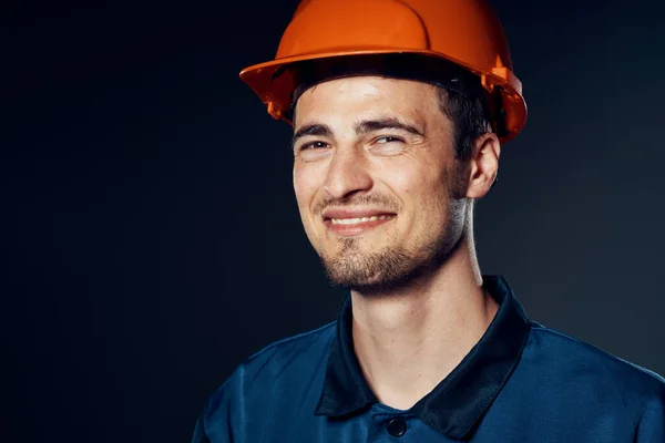 young worker in hardhat posing