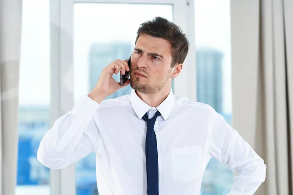 Emotional Businessman Talking Smartphone Office — Stock Photo, Image