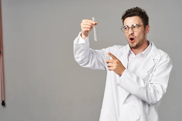 Young Handsome Doctor Lab Coat Pointing Test Tube Grey Background — Stock Photo, Image