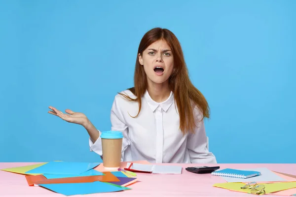 Young surprised  businesswoman   isolated on blue background