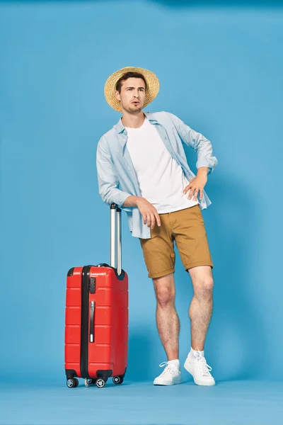 Young Man Red Suitcase Studio — Stock Photo, Image