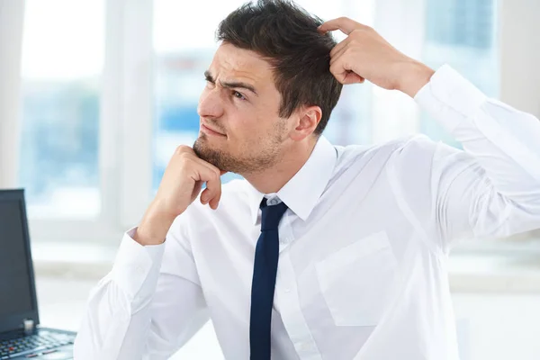 Young  businessman thinking   in the office