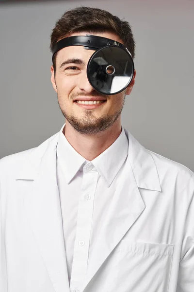 Studio shot. Young doctor  smiling on  isolated background