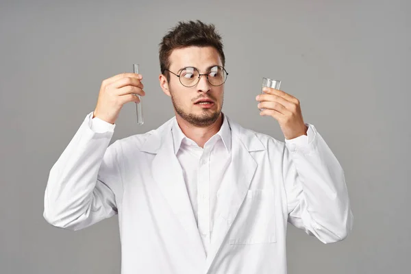 Confused Doctor Lab Coat Test Tubes Grey Background Studio Shot — Stock Photo, Image